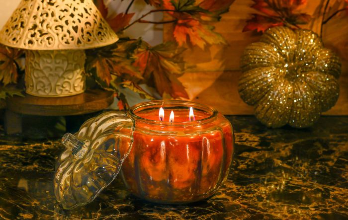 Lit pumpkin shaped jar candle