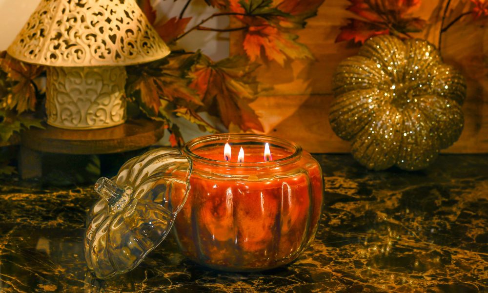 Lit pumpkin shaped jar candle