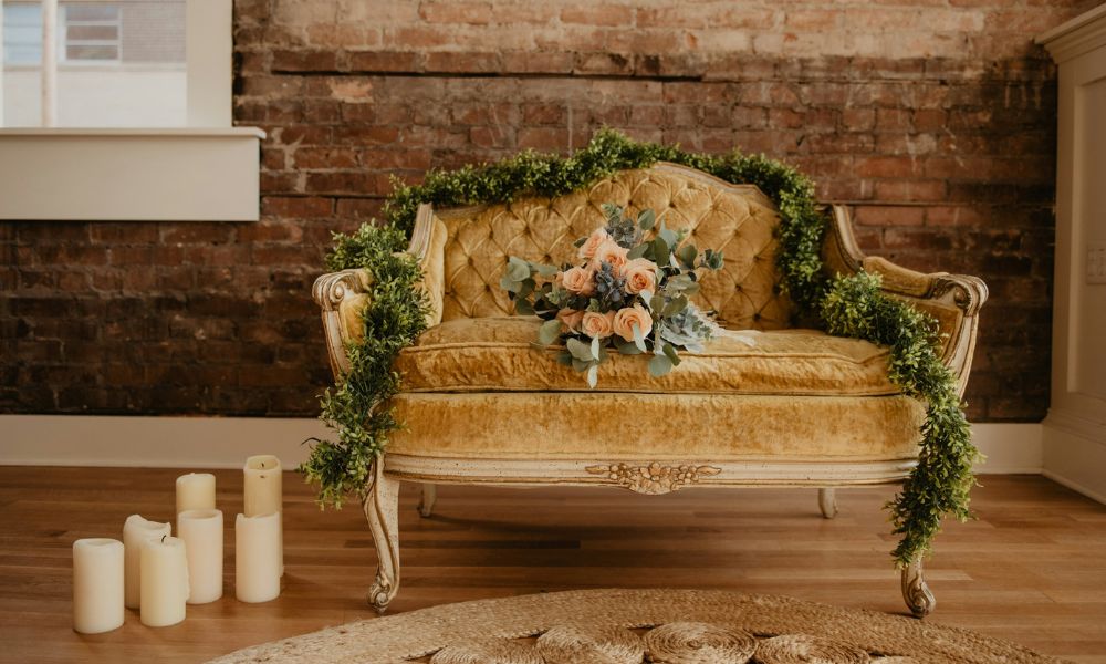 vintage couch with candles and florals