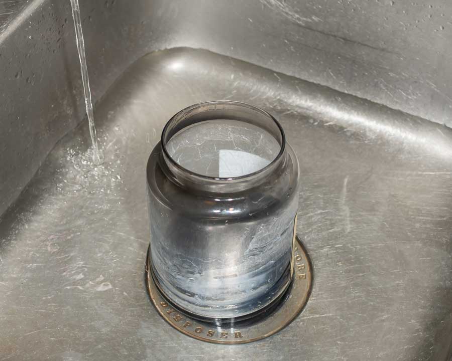 Dirty Jar in Sink of Hot Water