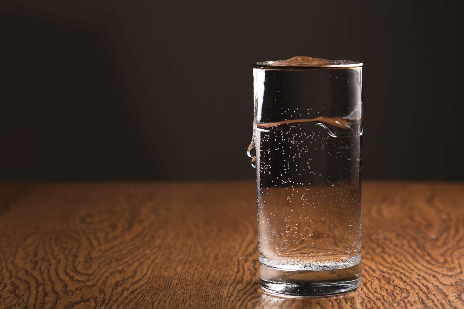 glass of water running over