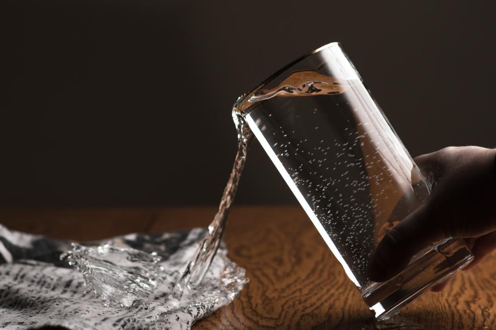 spilling glass of water