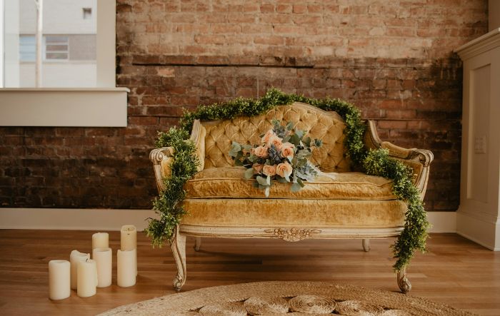 vintage couch with candles and florals