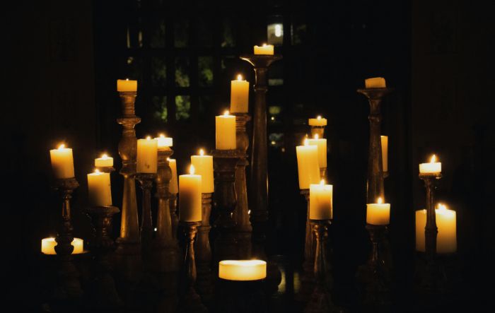 pillar candles on tall holders
