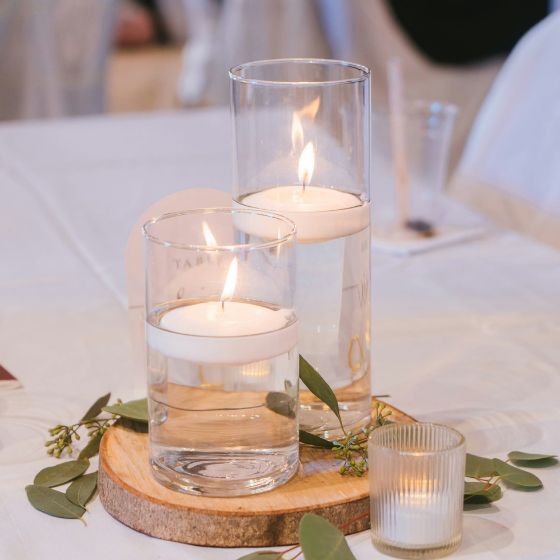floating candles in vases as a centerpiece