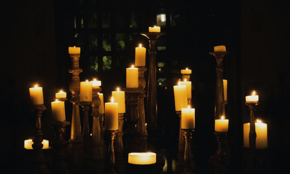 pillar candles on tall holders